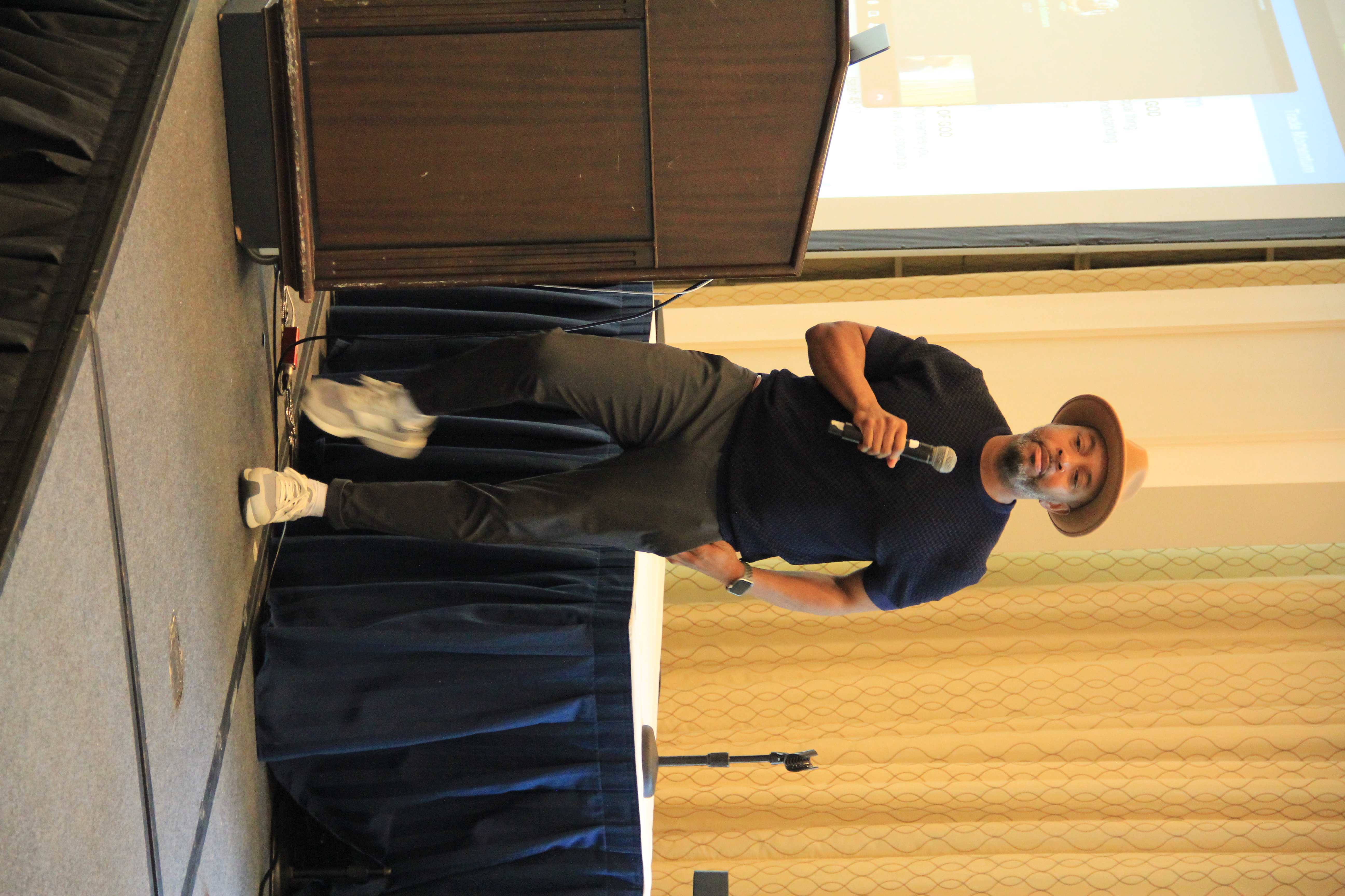 Coach Brian King on stage at Trade Momentum — institutional strategy, live delivery